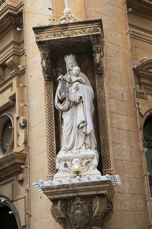 Religious statue Madonna and baby Jesus outside Carmelite church, Basilica of Our Lady of Mount Carmel, Valletta, Malta, Europe