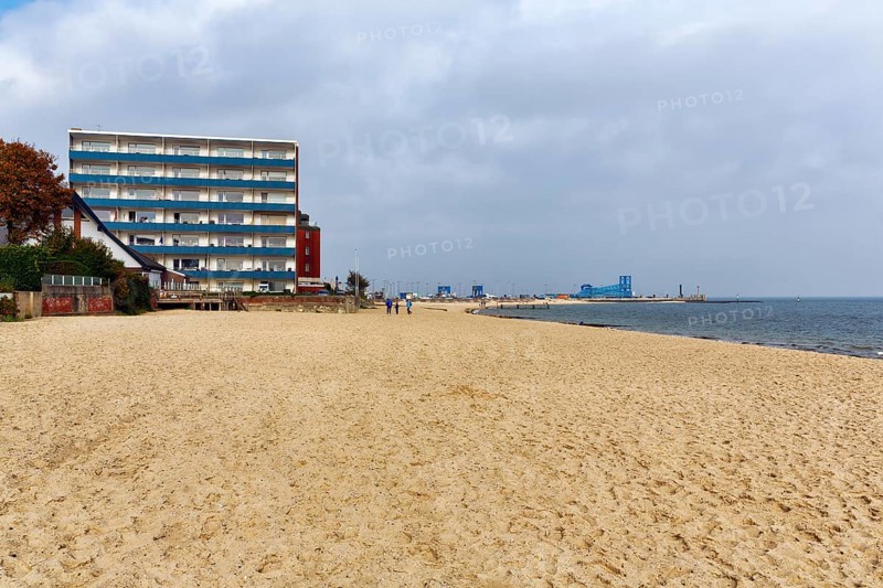 Empty beach with view of the ferry port, houses, autumn weather, Wyk auf Föhr, Insel Föhr, Nordfriesland, North Sea, Schleswig-Holstein, Germany, Europe