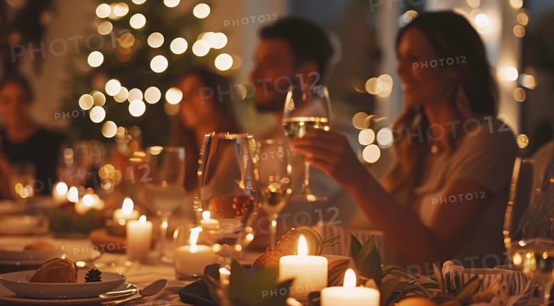 A group of people are sitting around a table with plates of food and celebrating, AI generated