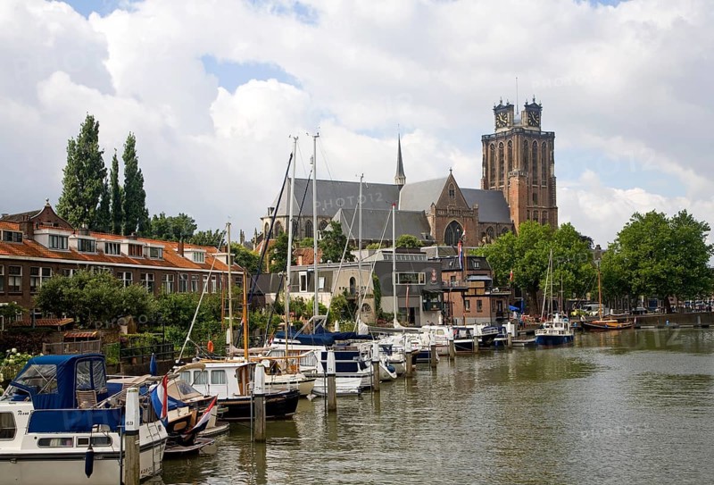Grote Kerk cathedral church and boats in Nieuwe Haven, Dordrecht, Netherlands