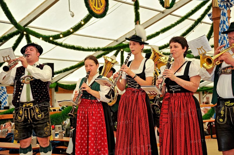 Musicians of a Bavarian brass band in traditional traditional costume playing the clarinet, old marquee, historic Wies'n, Oide Wiesn, Oktoberfest, Munich, Upper Bavaria, Bavaria, Germany, Europe