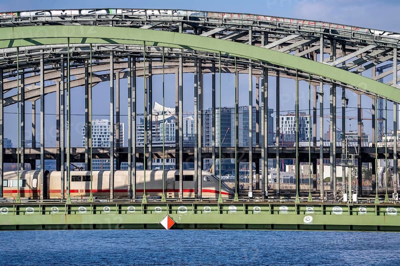 Railway Elbe bridges, at Elbbrücken station, spanning the Norderelbe, ICE train, in the background the skyline of Hamburg, Germany, Europe