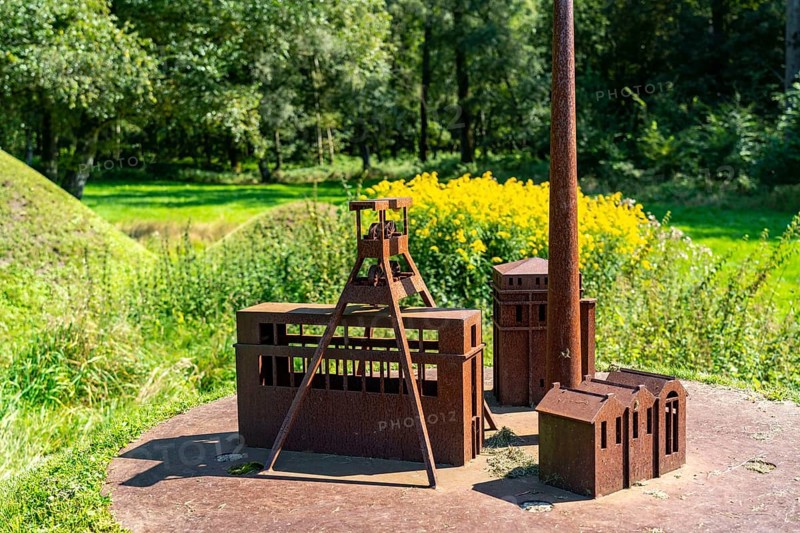 Art axis Burgenland, artwork by artist Nils-Udo, for the Ruhr.2010 Capital of Culture, 15 green hills, 8 of them with models made of Corten steel, of the pithead and Malakow tower of the Ewald colliery, on a 2 kilometre long path from Herten Castle Park to the Hoheward slag heap landscape, North Rhine-Westphalia, Germany, Europe