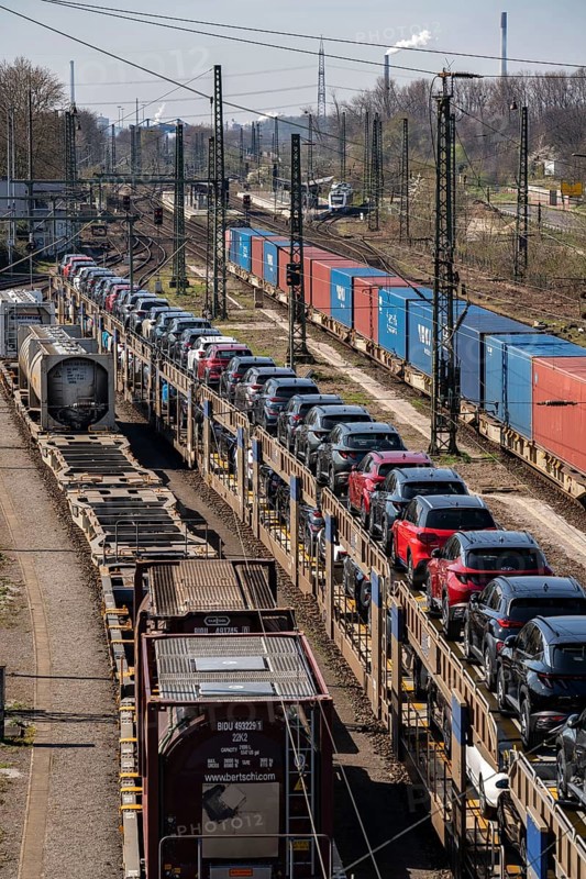 Duisburg-Rheinhausen freight station, at the Logport harbour area, goods trains loaded with new cars, various tank containers and the container train from China, on its way to the Logport, part of the new Silk Road, Duisburg, North Rhine-Westphalia, Germany, Europe