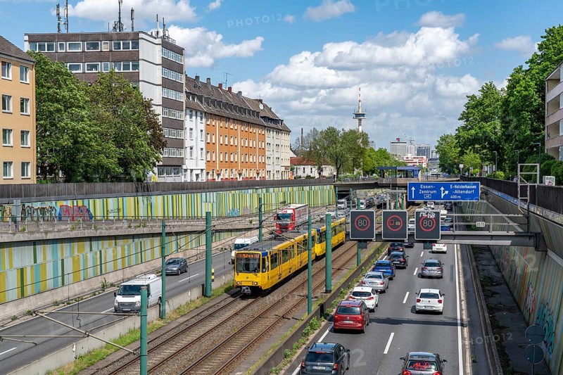 Motorway A40, Ruhrschnellweg, in the through road in Essen, noise barrier, tram, underground railway of the Ruhrbahn, North Rhine-Westphalia, Germany, Europe