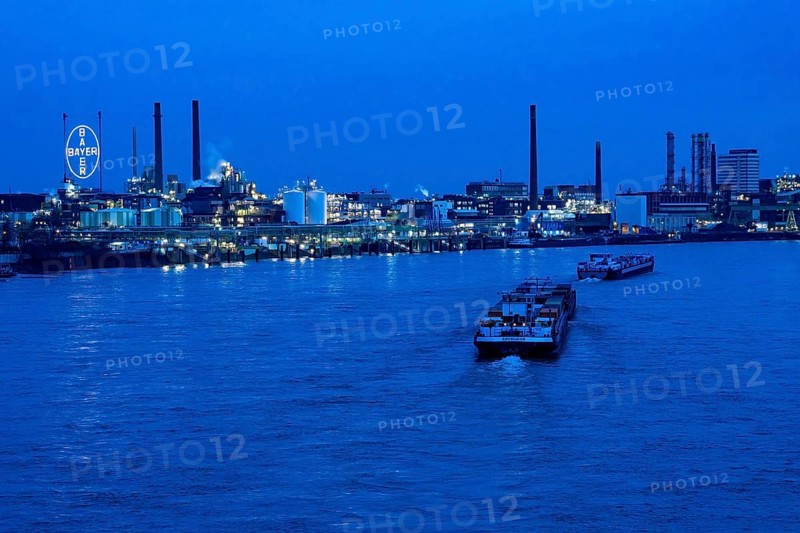 Backdrop of Chempark Leverkusen, Bayer Leverkusen, chemical park, chemical plant, river Rhine, cargo ship, Leverkusen, North Rhine-Westphalia, Germany, Europe
