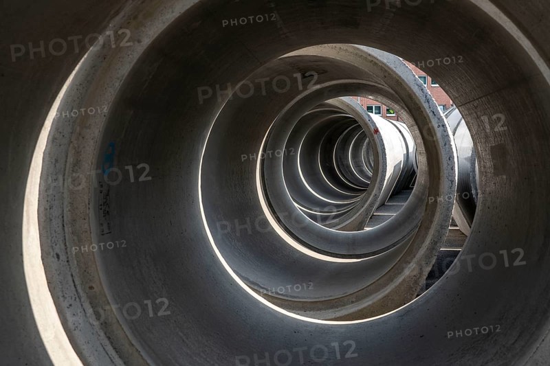 Concrete sewer pipes, stored on a construction site during sewer renovation work, on the Dickswall, city centre of Mülheim an der Ruhr, North Rhine-Westphalia, Germany, Europe