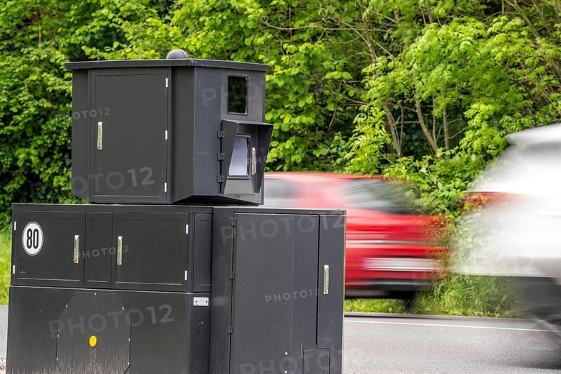Semi-stationary speed camera on the B227, Hattinger Straße, used by the city of Gelsenkirchen, model TraffiStar S350 from Jenoptik, the device is temporary, self-sufficient for up to a week, at various measuring points, can measure and flash in 2 directions, laser measurement technology, data is sent to the city via mobile radio, is installed on a protected trailer, popularly known as an armoured speed camera, here a 50 km/h zone, North Rhine-Westphalia, Germany, Europe