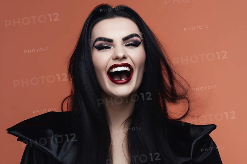 Smiling woman with Halloween vampire makeup and costume in front of studio background. KI generiert, generiert AI generated
