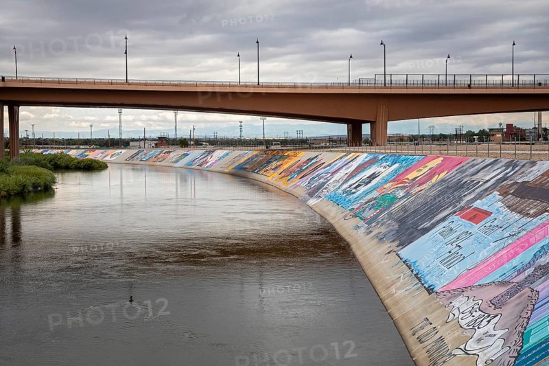 Pueblo, Colorado, Murals line a concrete levee for three miles along the Arkansas River. The levee was built after a disastrous 1921 flood. Students painted unauathorized murals in the 1970s, but the artwork has since become accepted as the Pueblo Levee Mural Project