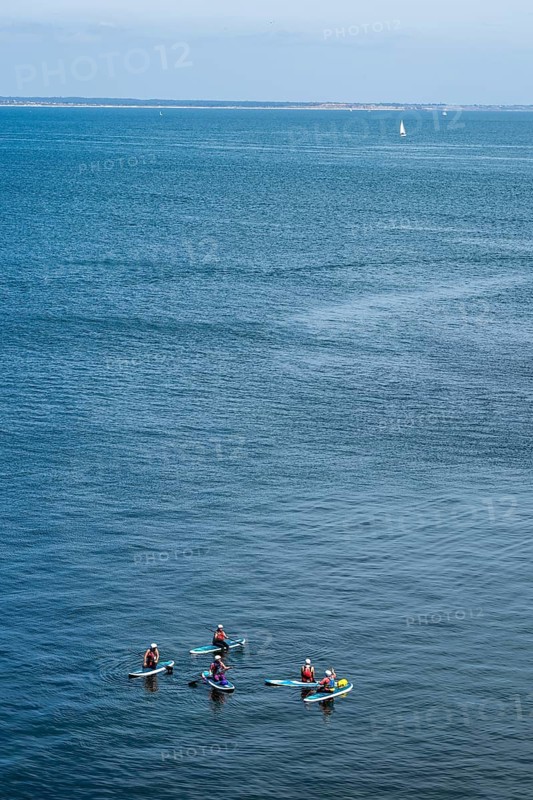 People on paddleboards, White Cliffs. Old Harry Rocks Jurassic Coast, Dorset Coast, Poole, England, United Kingdom, Europe