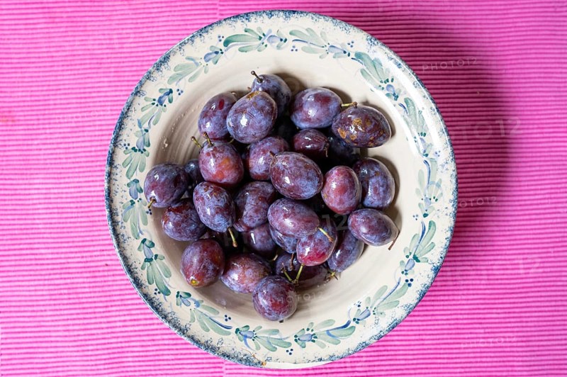 Fresh plums (Prunus domestica) in a bowl, Bavaria, Germany, Europe