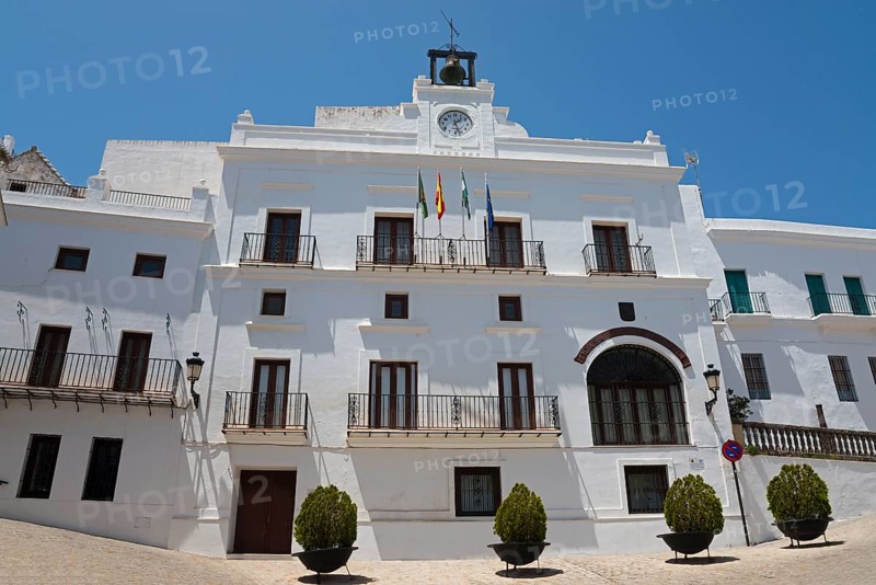 Representative white building with balconies and flags on the roof under a clear sky, town hall, Ayuntamiento, Plaza de España, Vejer de la Frontera, Cadiz province, Cadiz, Andalusia, Spain, Europe