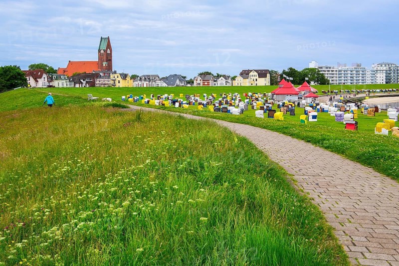 Grassy beach on the dyke with beach chairs and St Peter's Church in the district of Grimmershörn, North Sea spa town of Cuxhaven, North Sea coast, Elbe, Elbe estuary, Lower Saxony, Germany, Europe