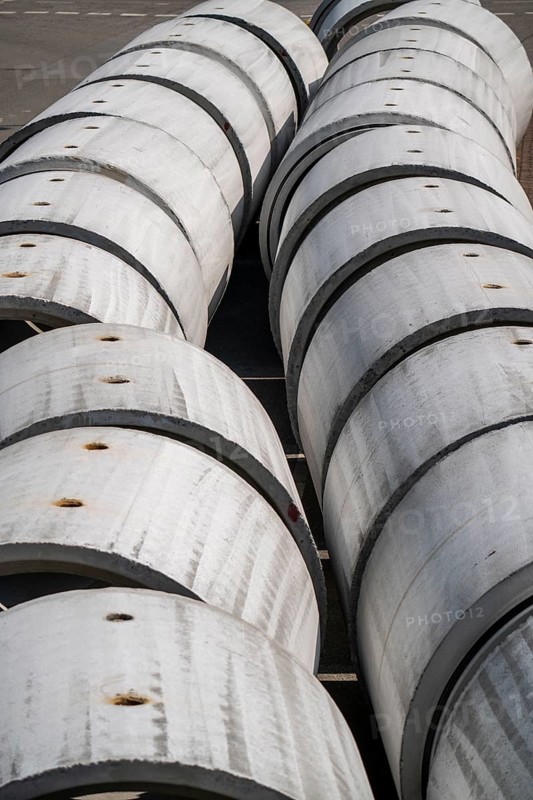 Concrete sewer pipes, stored on a construction site during sewer renovation work, on the Dickswall, city centre of Mülheim an der Ruhr, North Rhine-Westphalia, Germany, Europe