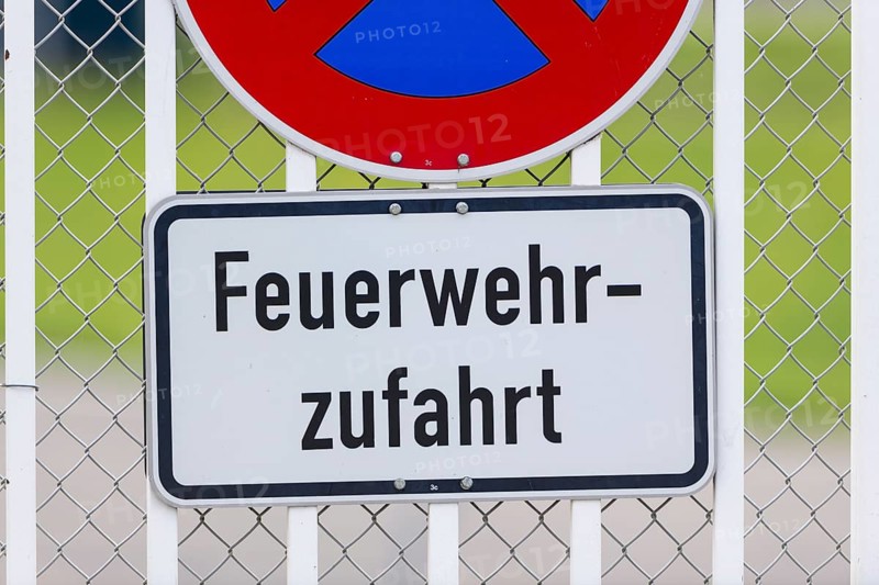 Signs on an airport barrier fence, absolute stopping ban, fire brigade access road, Stuttgart, Baden-Württemberg, Germany, Europe