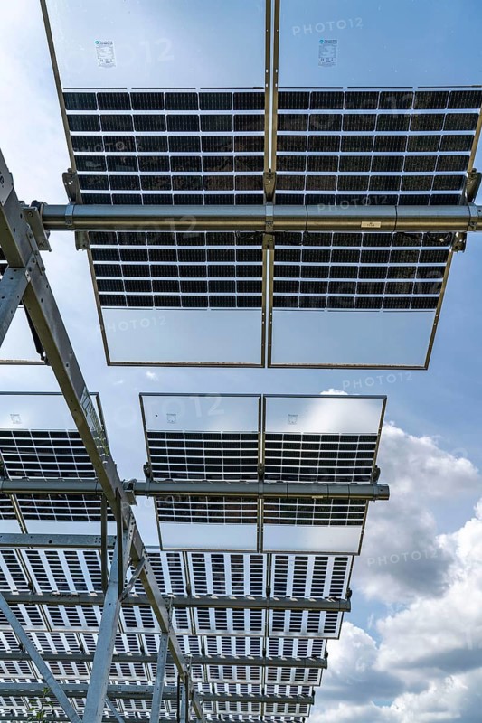 Agri-photovoltaic test plant, an apple orchard with two different systems of PV modules was roofed over 3000 square metres, rain and sunlight comes through, at the same time protection against hail and heavy rain, next to it are the same trees but without a solar roof, as a comparison object, how the PV roof affects the trees and harvest, the field test is accompanied by the Fraunhofer Institute for Solar Energy Systems ISE, in Grafschaft-Gelsdorf, Rhineland-Palatinate, Germany, Europe