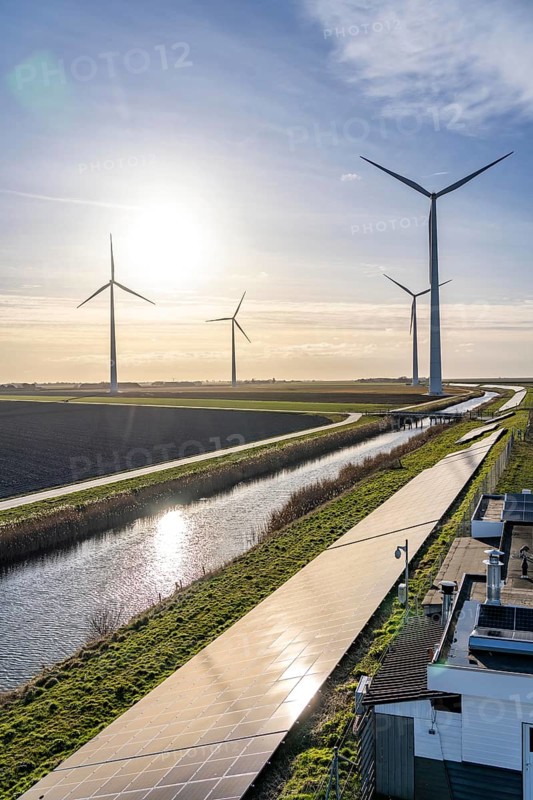 Solar park on the Slaperdijk dyke near the Eemshaven, test project, 17, 000 solar modules were installed over a good 5 kilometres, the Netherlands has over 22, 000 kilometres of dyke line, here it is being tested whether such an installation is successful and can be expanded, wind farm, Groningen, Netherlands