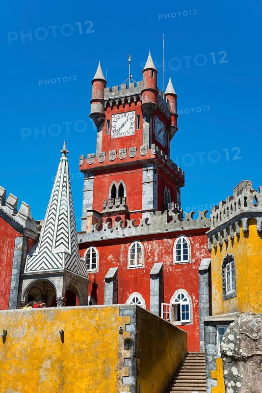 Red tower with clock and yellow façade, pointed roof and blue sky, Palácio Nacional da Pena, Pena National Palace, Sintra, Lisbon, World Heritage Site, UNESCO, Portugal, Europe