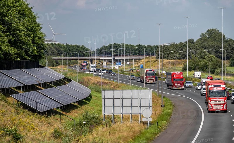 A58 motorway, photovoltaic systems were installed on the slopes to the side of the carriageway, use of the areas along the roads as a solar park, near Etten-Leur, Noord-Brabant, Netherlands
