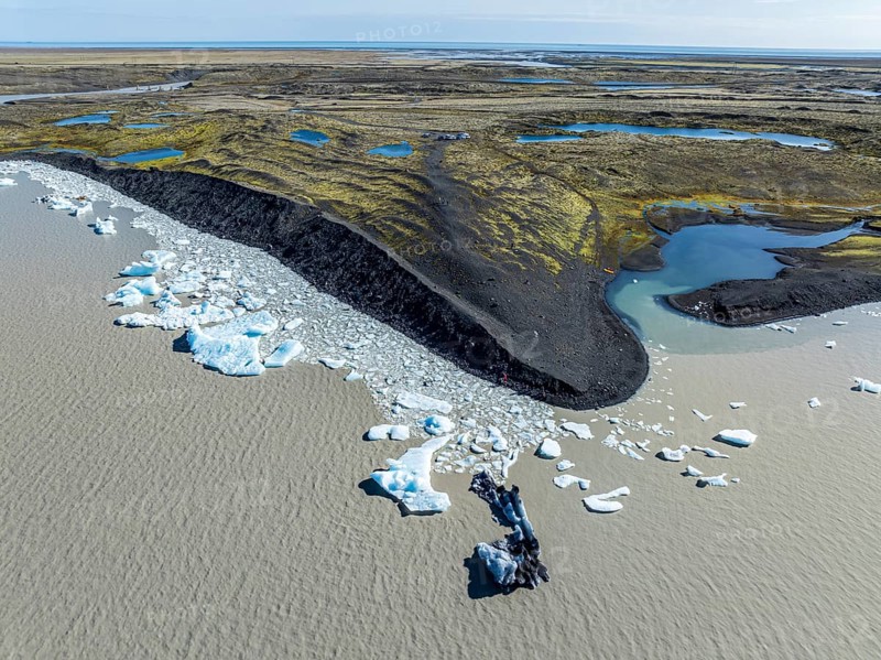 Aerial view over the glacial lake Fjallsárlón, glacier Fjallsjökull, part of Vatnajökull glacier, Iceland, Europe