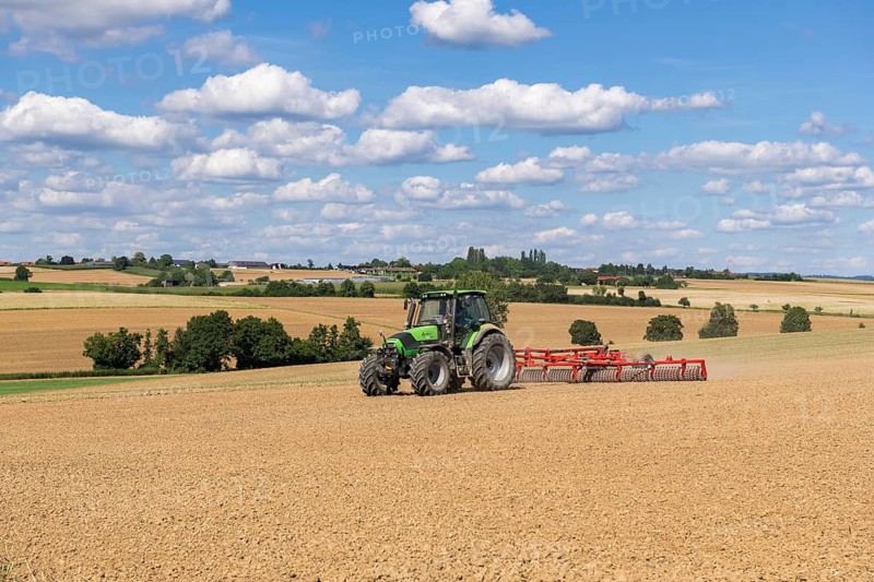 Farmer tilling a field, tractor, ploughing, clouds, Baden-Württemberg, Germany, Europe
