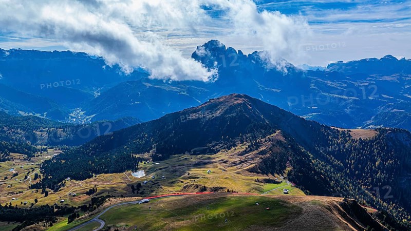 Summit of the Picberg, in the background the peaks of the Sassolungo group, shrouded in fog, drone shot, Val Gardena, Dolomites, Autonomous Province of Bolzano, South Tyrol, Italy, Europe