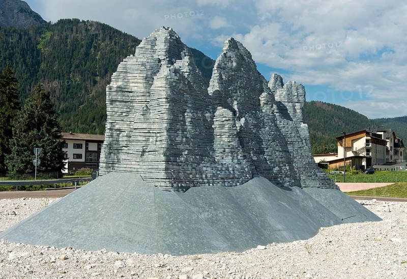 Sculpture The Pale Mountains in the shape of the Three Peaks by Paul S. Feichter and Albert Willeit. Dobbiaco roundabout, South Tyrol, Trentino-Alto Adige, Italy, Europe