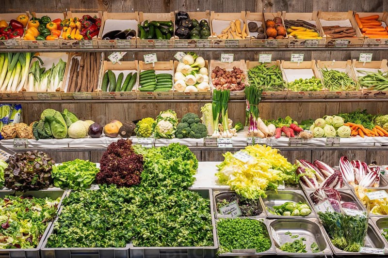 Market stall with a wide range of local and exotic vegetables in the Markthalle Stuttgart, Baden-Württemberg, Germany, Europe