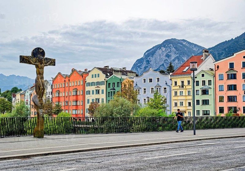 Mariahilf St. Nikolaus, oldest part of Innsbruck with the Inn bridge and the crucifix by Rudi Wach, Innsbruck, Tyrol, Austria, Europe