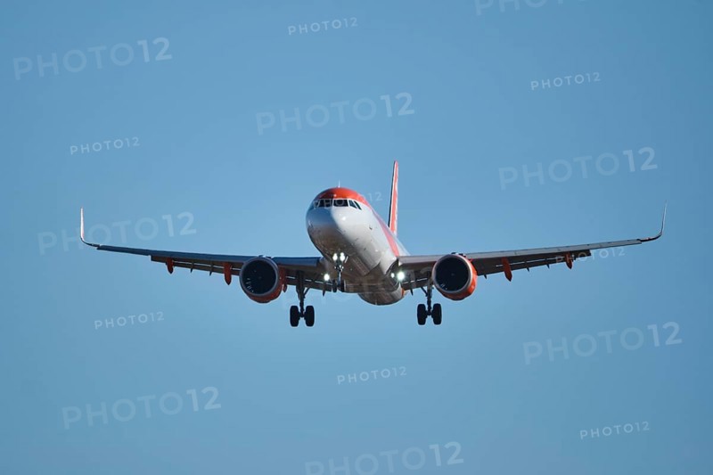 Lisbon, Portugal - September 2, 2023: easyJet Airbus A320-214 passenger plane descends to land in Humberto Delgado Airport in Lisbon