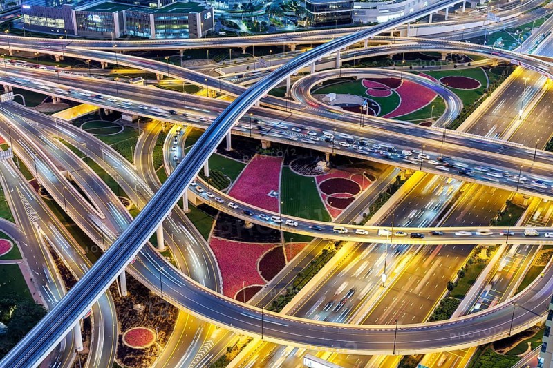Intersection of Sheikh Zayed Road traffic on the road near the Burj Khalifa with Metro in Dubai, United Arab Emirates, Asia