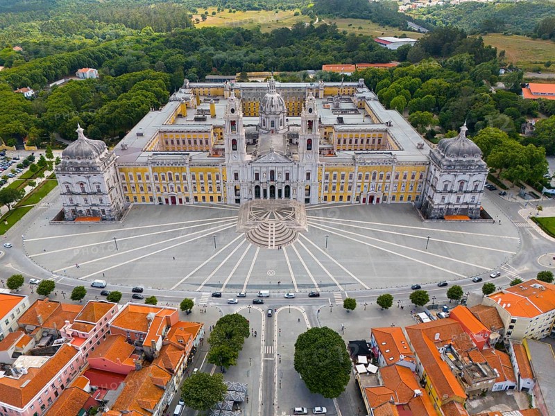 Historical palace captured in impressive symmetry as an aerial view, surrounded by green vegetation, Aerial view, Palace, Palácio Nacional de Mafra, Lisbon, Lisboa, Portugal, Europe