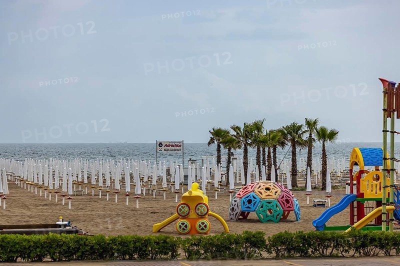 Bagni Lungomare, Chioggia. Bathing beach on the Adriatic in bad weather. All deckchairs are free. Chioggia, Veneto, Italy, Europe