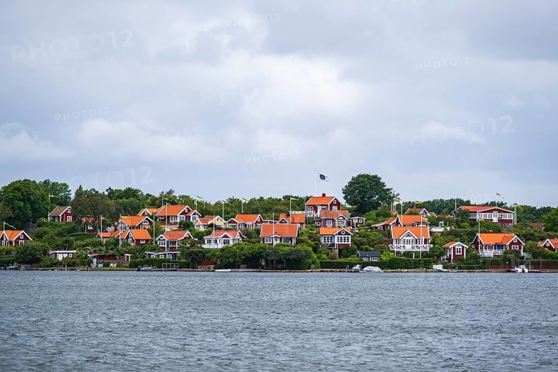 View from the island of Saltö to the famous allotment garden colony Brändaholm on the island of Dragsö in the archipelago of Karlskrona, Blekinge län, Sweden, one of Sweden's most common picture postcard motifs, Europe
