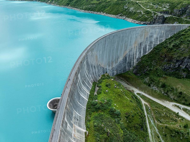 Dam of the Moiry lake, Lac de Moiry, turquoise glacial water, water overflow, tourists, aerial view, Valais, Switzerland, Europe