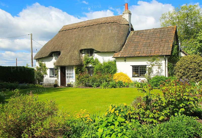 Pretty thatched country cottage and garden, Cherhill, Wiltshire, England, UK, property released
