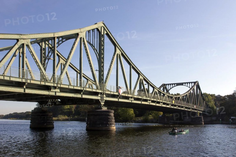 Anglers in a boat at the Glienicke Bridge in Potsdam. The Glienicke Bridge today forms the city boundary between Berlin and Potsdam and was the borderline and a handover point for spies from East and West during the division of Germany, 22/09/2016