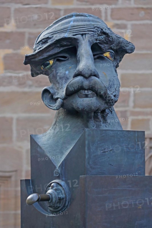 Sculpture Lech and Malsche by Jürgen Goertz, Lech, male figure, head, face, bizarre, abstract, modern, whimsical, bronze, nose, mouth, thick, bulging, upper lip, ear, Johann-Sebastian-Bach-Platz, Ansbach, Middle Franconia, Franconia, Bavaria, Germany, Europe