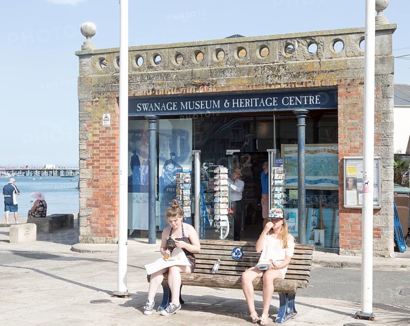 Museum and Heritage centre Swanage, Dorset, England, UK two girls eating chips