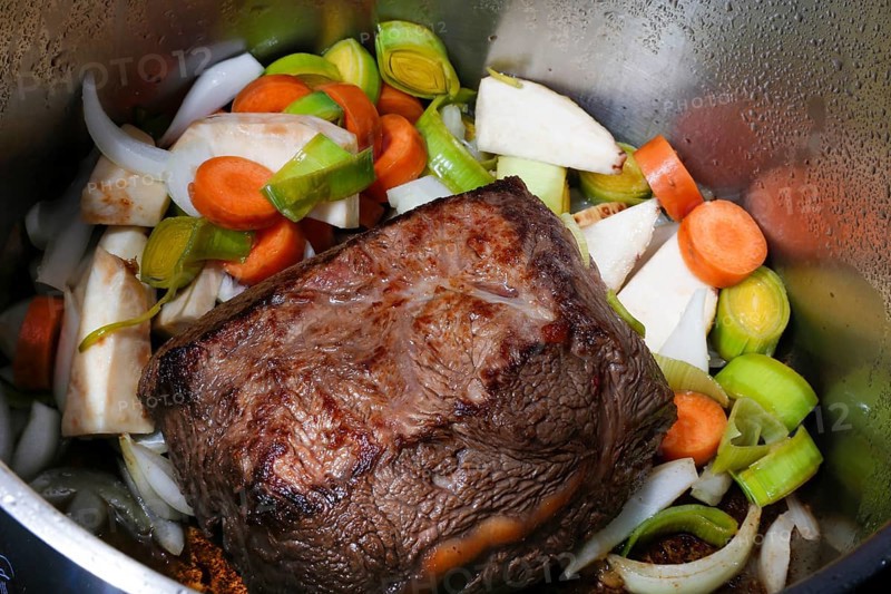 Swabian cuisine, preparation cider roast, roast ox in cooking pot, vegetables, roast, meat dish, savoury, salty, typical Swabian, home cooking, traditional cuisine, food photography, studio, Germany, Europe