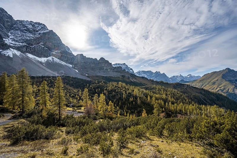 Mountain panorama with steep rocky peaks, yellow-coloured larches in autumn, hike to the summit of the Hahnkampl, Engtal, Karwendel, Tyrol, Austria, Europe