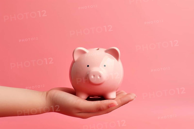 Hand holding piggy bank on pink background. KI generiert, generiert AI generated