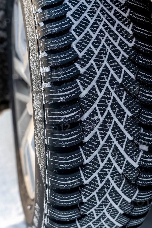 Winter tyres, driving on a road with snow cover, grip on the snow thanks to the special tread and rubber compound, the tyre for winter