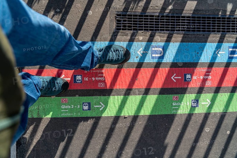 Signpost on the pavement, for bus and train diversions at Dortmund Central Station, during construction work, North Rhine-Westphalia, Germany, Europe