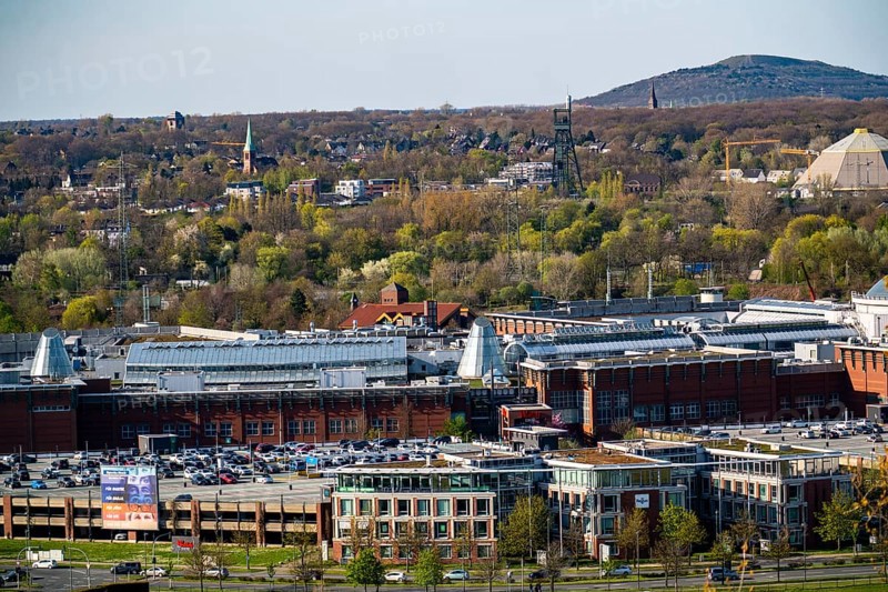 The Westfield Centro shopping centre, Neue Mitte, behind the Olga Park with the headframe of the former Osterfeld colliery, behind the Haniel slagheap, North Rhine-Westphalia, Germany, Europe