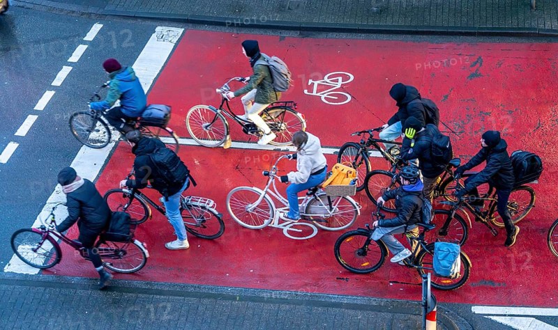 Cycle lane, space for cyclists at a traffic light crossing, marked red, cars, lorries must stop behind it at red light, Münster, North Rhine-Westphalia, Germany, Europe