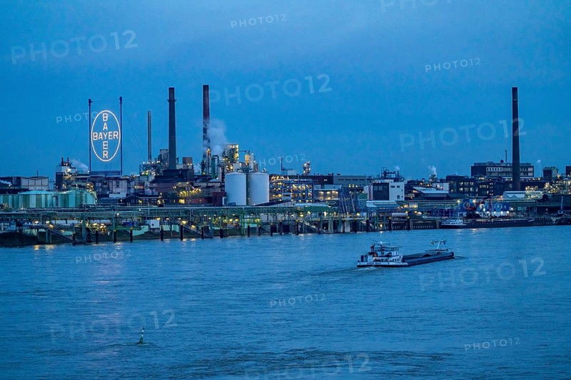 Backdrop of Chempark Leverkusen, Bayer Leverkusen, chemical park, chemical plant, river Rhine, cargo ship, Leverkusen, North Rhine-Westphalia, Germany, Europe