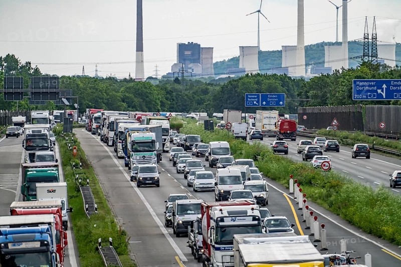 Traffic jam on the A2 motorway near Bottrop, behind the Bottrop motorway junction, in the direction of Oberhausen, due to a long-term construction site, renewal of the lanes, reduction of the lanes from 4, incl. access from the A31, to 2 lanes, daily traffic jam, in the background the UNIPER coal-fired power plant Gelsenkirchen Scholven, North Rhine-Westphalia, Germany, Europe