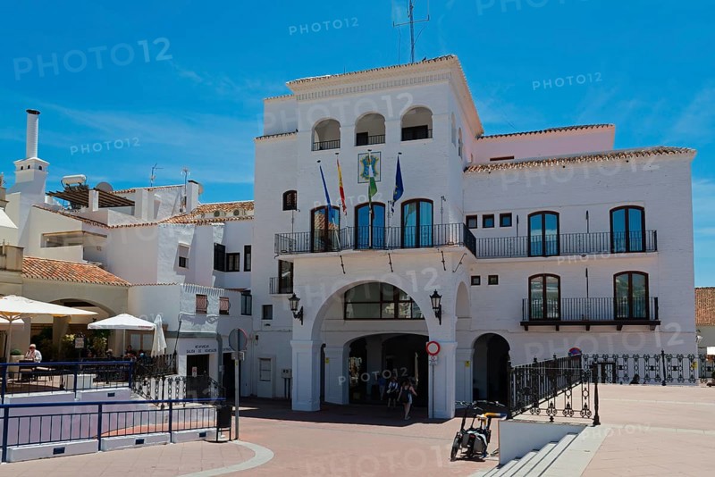 White Spanish building with flags and balconies under a blue sky, town hall, Nerja, Málaga province, Malaga, Costa del Sol, Andalusia, Spain, Europe